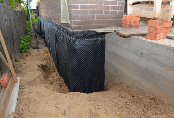 Happy homeowners after waterproofing job in Michigan Center
